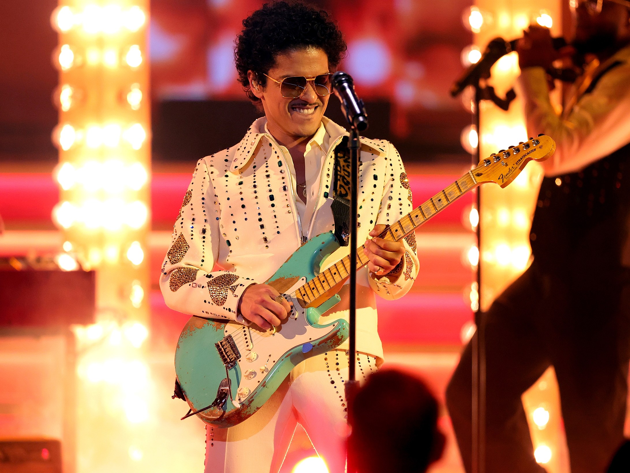 A close call for Bruno Mars and his band. Bruno Mars of Silk Sonic performs onstage during the 64th Annual GRAMMY Awards at MGM Grand Garden Arena on April 03, 2022 in Las Vegas, Nevada. (Photo by Rich Fury/Getty Images for The Recording Academy)